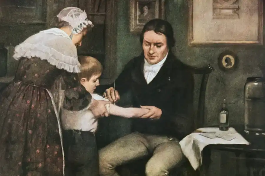 Painting by Ernest Board depicting Edward Jenner inoculating a young boy with pus from a cowpox sore.