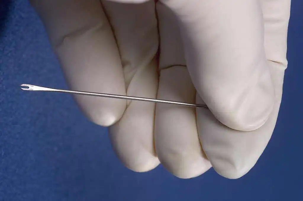 Bifurcated needle used to administer the smallpox vaccine